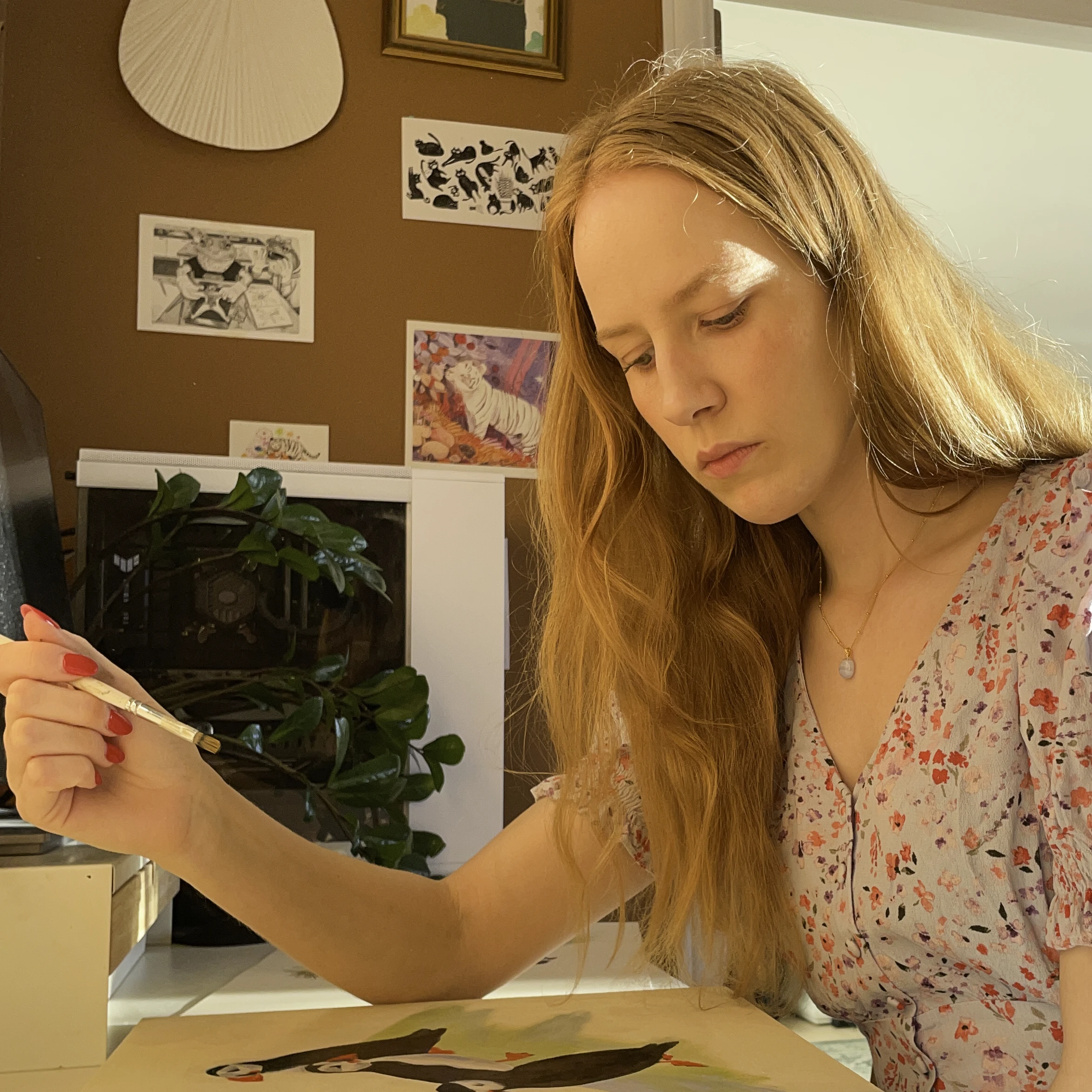 Erin Skilbrei focused on her painting in the studio.